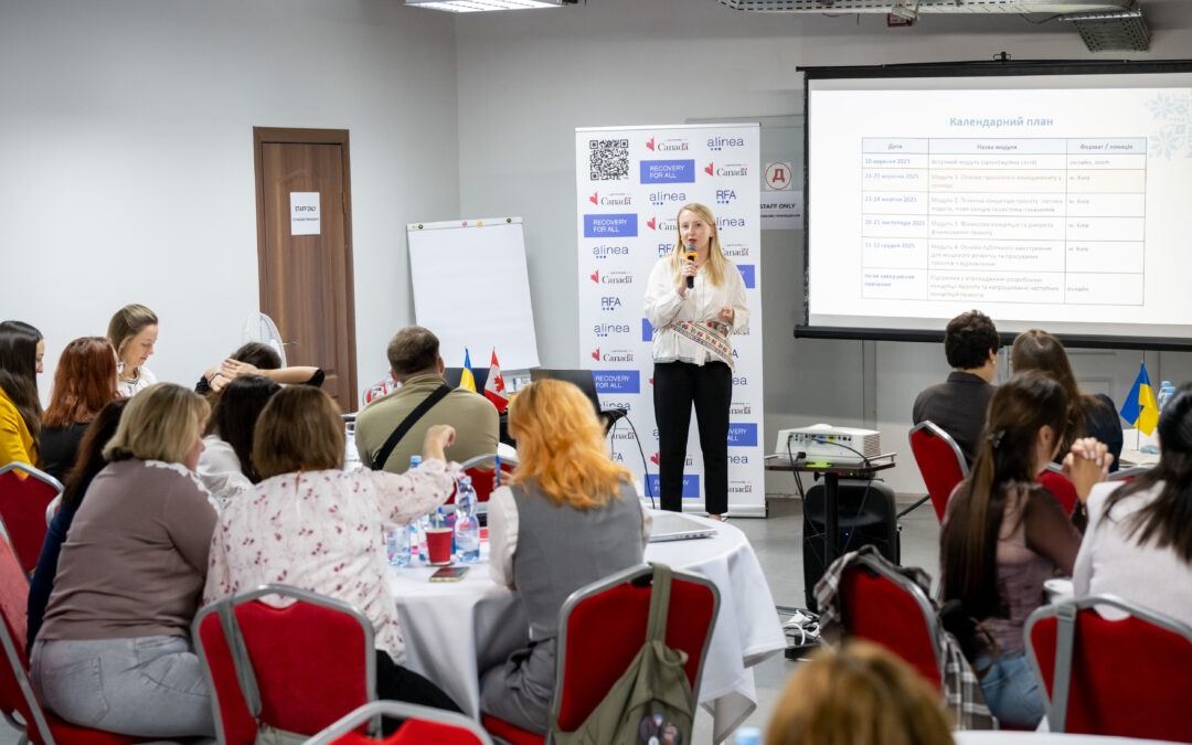 The image shows a woman talking during the RFA project management training for municipalities.